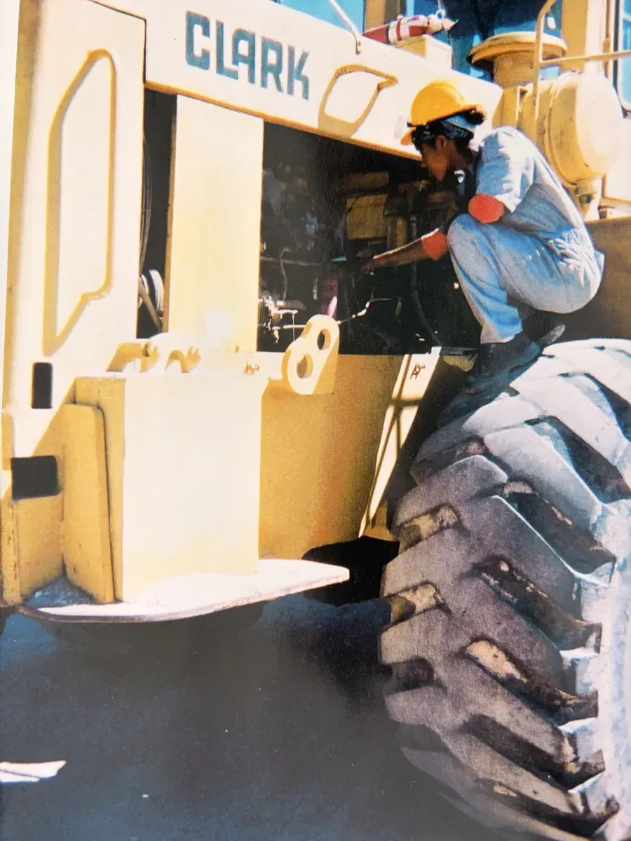 Professional trucking mechanics diagnosing diesel engines
